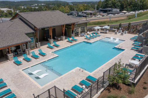 Canopy Park Apartments large swimming pool and sundeck with ample loungers at Canopy Park Apartments, Pelham, 35124