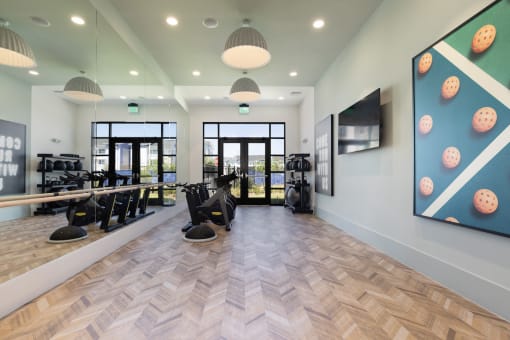 spin and yoga studio with huge mirrors and TV at Lake Nona Concorde