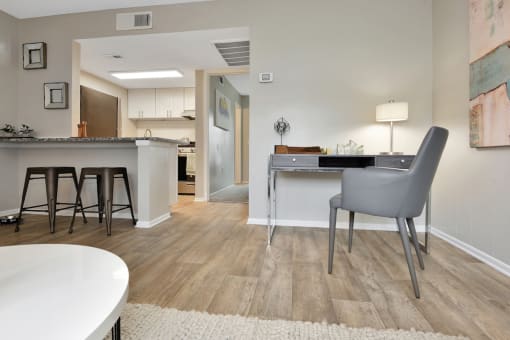 wood-style flooring and model furnishings in the model 1-bedroom apartment at The Oasis Daytona