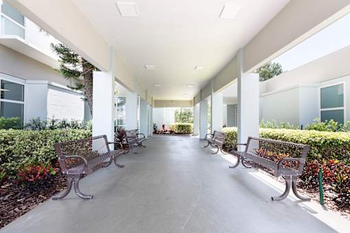 A long hallway with benches on either side.