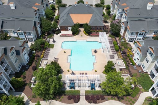Fenwyck Manor's lushly landscaped pool and sundeck area