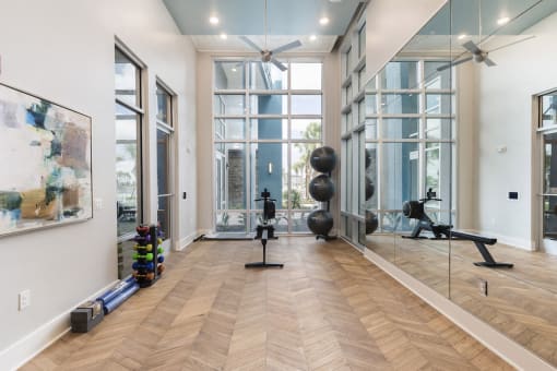 Modern fitness on demand studio with yoga equipment at Residences at The Green in Lakewood Ranch