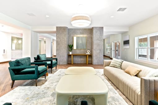 a living room with a couch and chairs