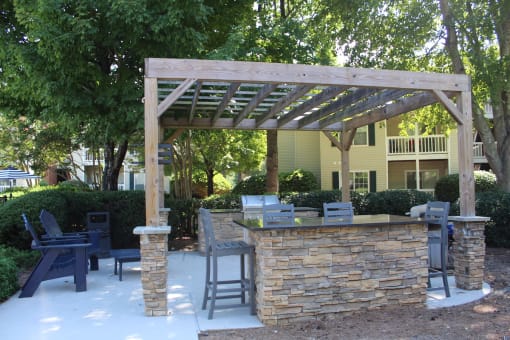 Poolside grill, lounge, and pergola at Stillwater at Grandview Cove