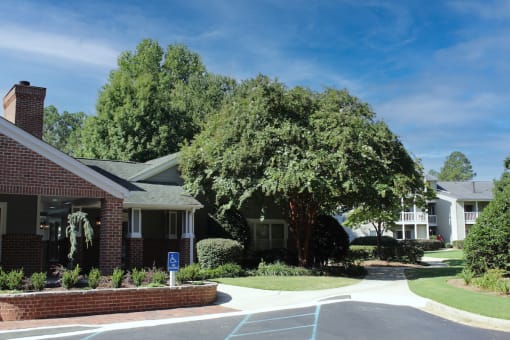 Lushly landscaped grounds near Stillwater at Grandview Cove's clubhouse