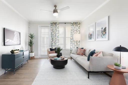 a living room with a couch and a tv