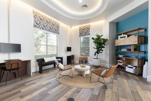 a living room with two chairs and a table