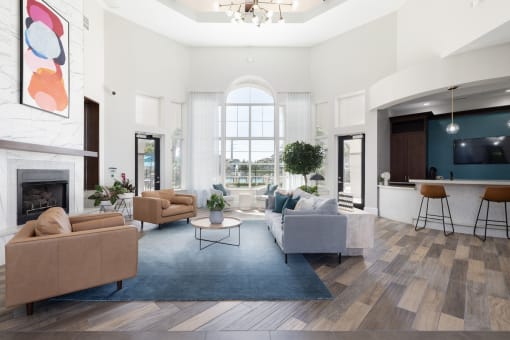 a living room with couches and chairs and a fireplace