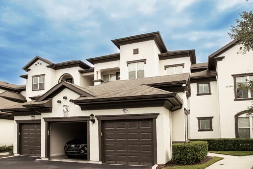 car sitting in garage in front of apartments at Lake Nona Water Mark