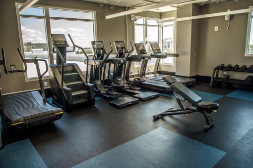 cardio equipment in front of windows in fitness center at Lake Nona Pixon, Florida, 32827