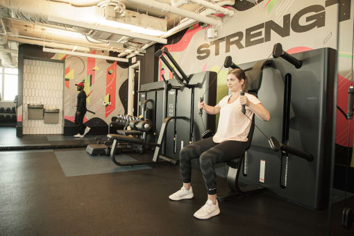 woman working out with resistance equipment at Pixon fitness center at Lake Nona Pixon, Florida, 32827