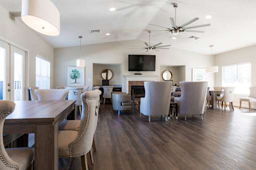 A modern dining room with a wooden table and chairs.
