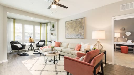furnished model apartment with hardwood-inspired flooring