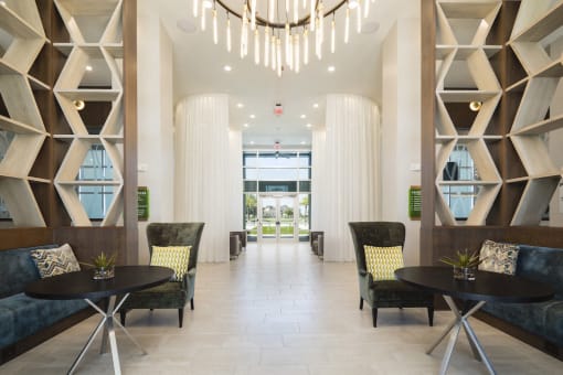 Lobby with private conversation nooks and luxury furnishings at Residences at The Green in Lakewood Ranch, FL