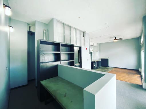 loft with built in shelving and seating at Jemison Flats, Birmingham, 35203