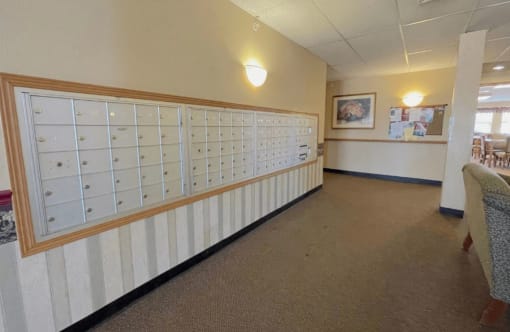 rows of aluminum mailboxes inside Algongquin Manor