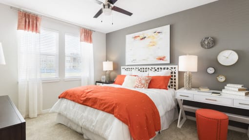 spacious master bedroom with designer paint colors and plush carpet