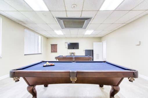 pool tables and TV in resident lounge area