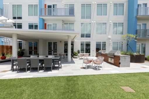 grilling patio with dining area on amenity deck at Lake Nona Pixon, Orlando, Florida