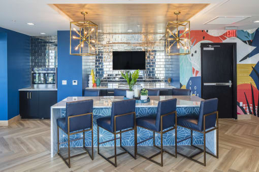 Upstairs lounge in Pixon with wine fridge, seating island and tv at Lake Nona Pixon, Orlando