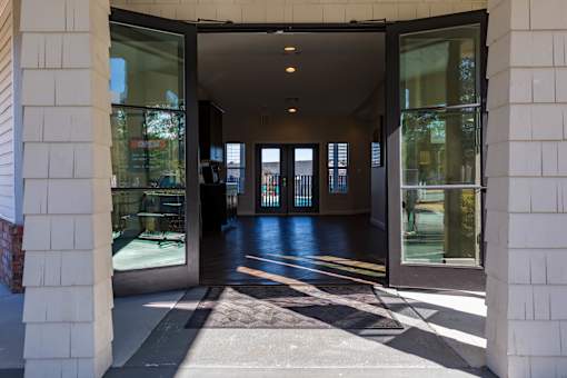 A white building with a glass door entrance.