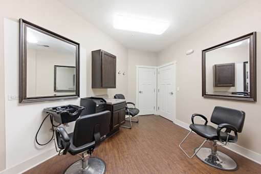 A room with a mirror and a chair.