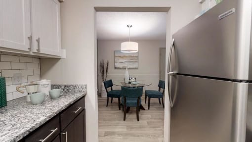 Kitchen with granite countertops and stainless steel appliances at The Madison Franklin, Tennessee, 37064