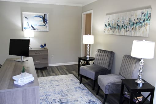 the leasing office with guest seating and desk at The Bluffs Apartments in Jasper, AL