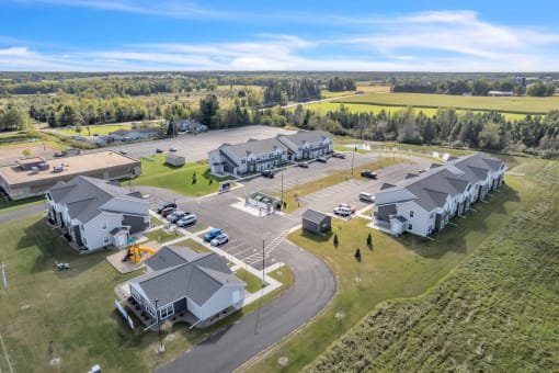 a group of houses and a parking lot