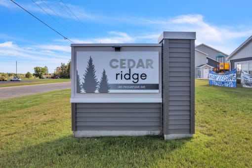 the sign for cedar ridge in front of a house