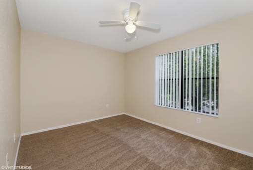 Bedroom with carpet flooring and multi speed ceiling fan