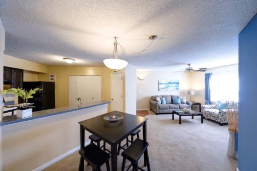 Dining area next to kitchen facing the living room