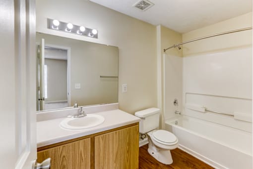 the preserve at ballantyne commons apartment bathroom with sink toilet and shower