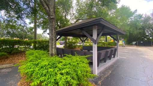 Outdoor shaded Gazebo seating next to car care center