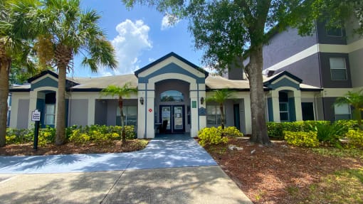 Leasing office exterior with native landscaping