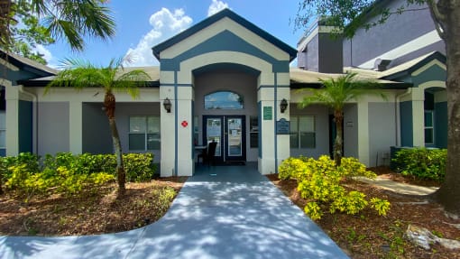 Leasing office exterior with native landscaping