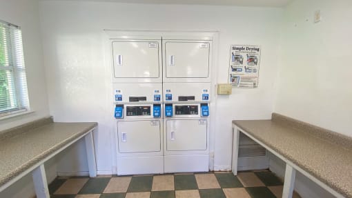 Clothing care center with washers, dryers, and folding station