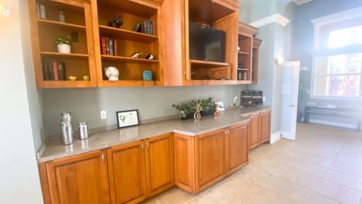 Clubhouse lounge with book shelves and television