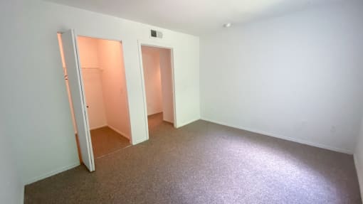 Carpeted Bedroom with folding closet door