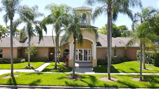 Leasing Office Exterior with Walkway and Palm Trees