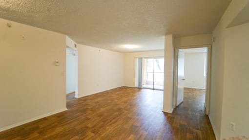 Open Floor Plan with Hardwood Style Flooring and Sliding Glass  Patio Door