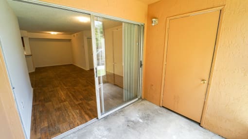 Patio with Sliding Glass Doors and Storage Closet