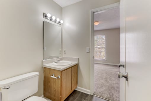 an empty bathroom with a toilet and a sink