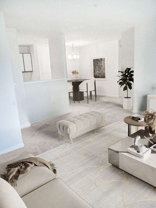 A living room with a grey sofa and a coffee table.