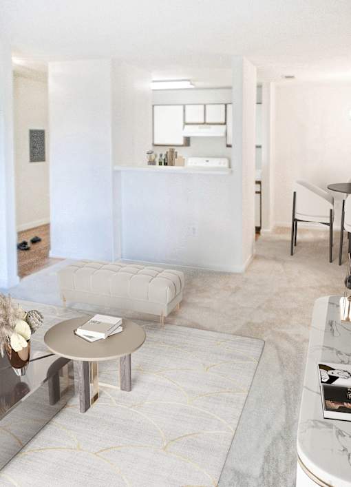 A modern living room with a grey coffee table and a white sofa.