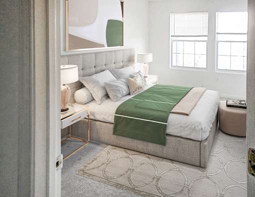 A bedroom with a large bed and a painting on the wall.