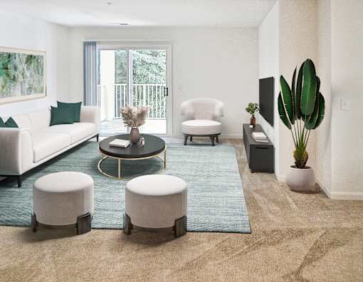 A living room with a white couch, a coffee table, and a large potted plant.