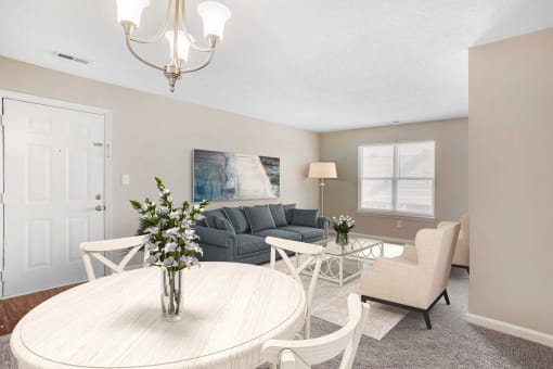 Dining room with a virtual dining room table and sofa with a coffee table in the background