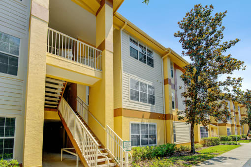 Building exterior with stair case and native landscaping