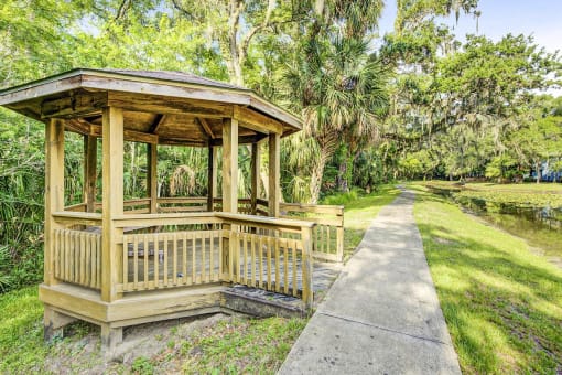 Gazebo Surrounded by Trees Next to Sidewalk